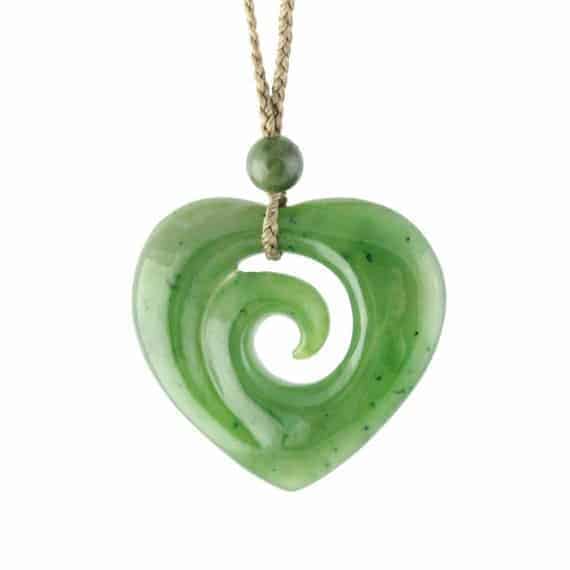 Jade heart shaped pendant with a koru spiral in the centre
