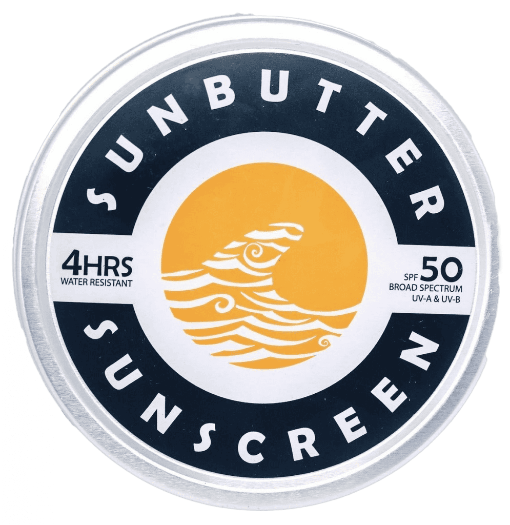 Sunbutter sunscreen metal tin with lid off showing white sunscreen